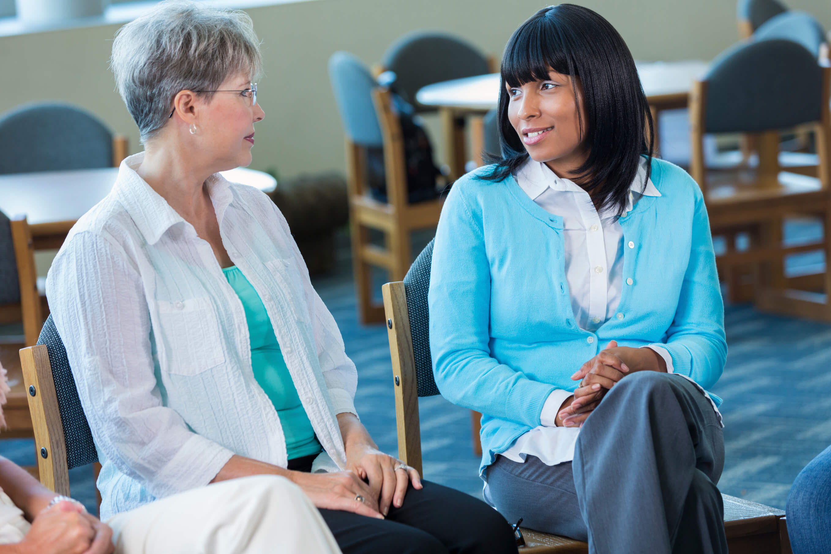 two women talking in a support group